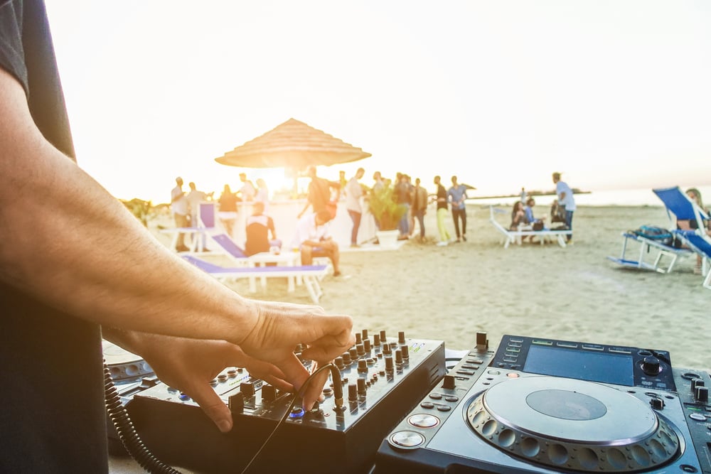 DJ on the beach playing music