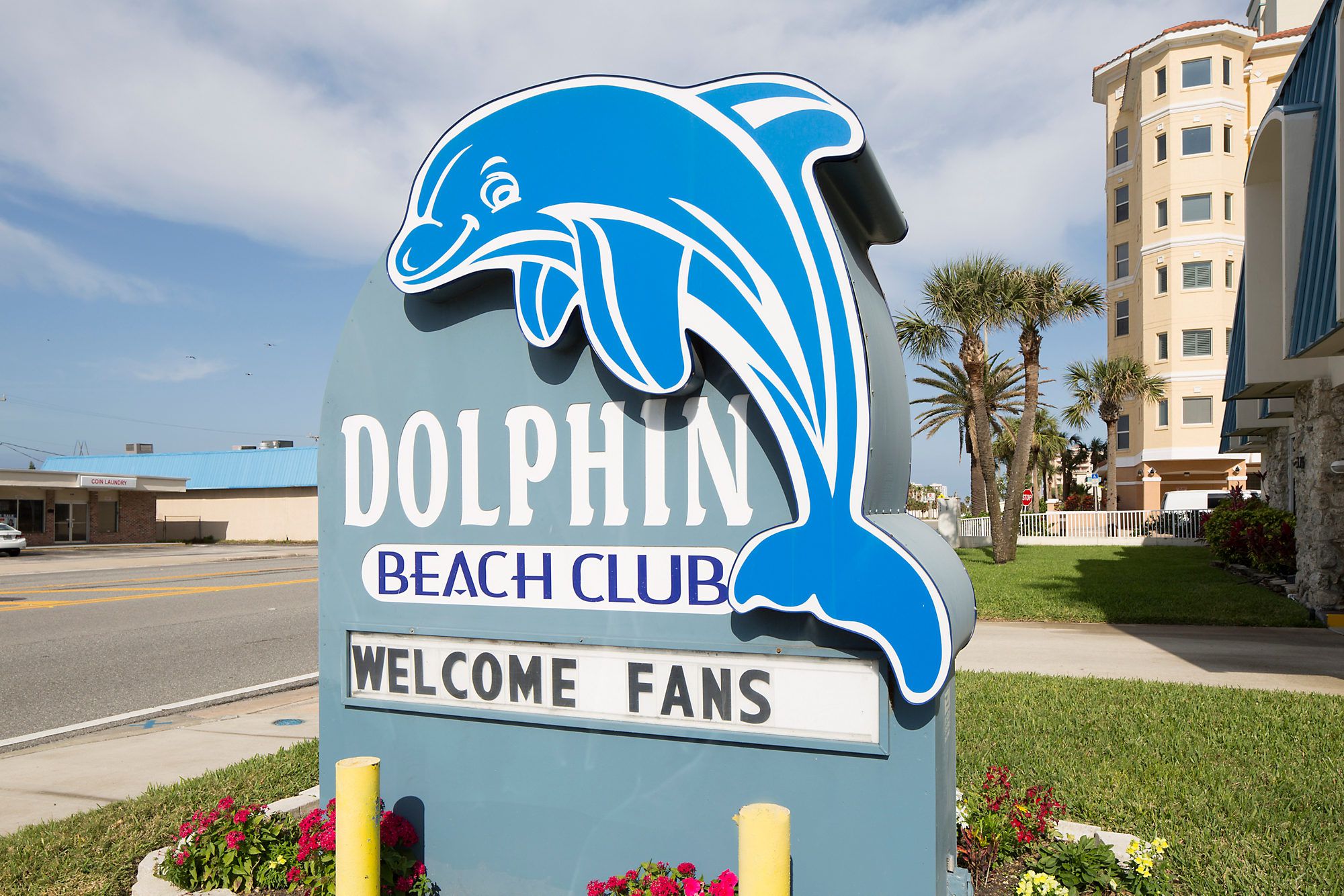 dolphin beach club sign