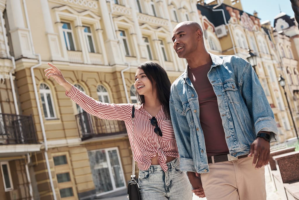 A couple walking the city streets holding hands