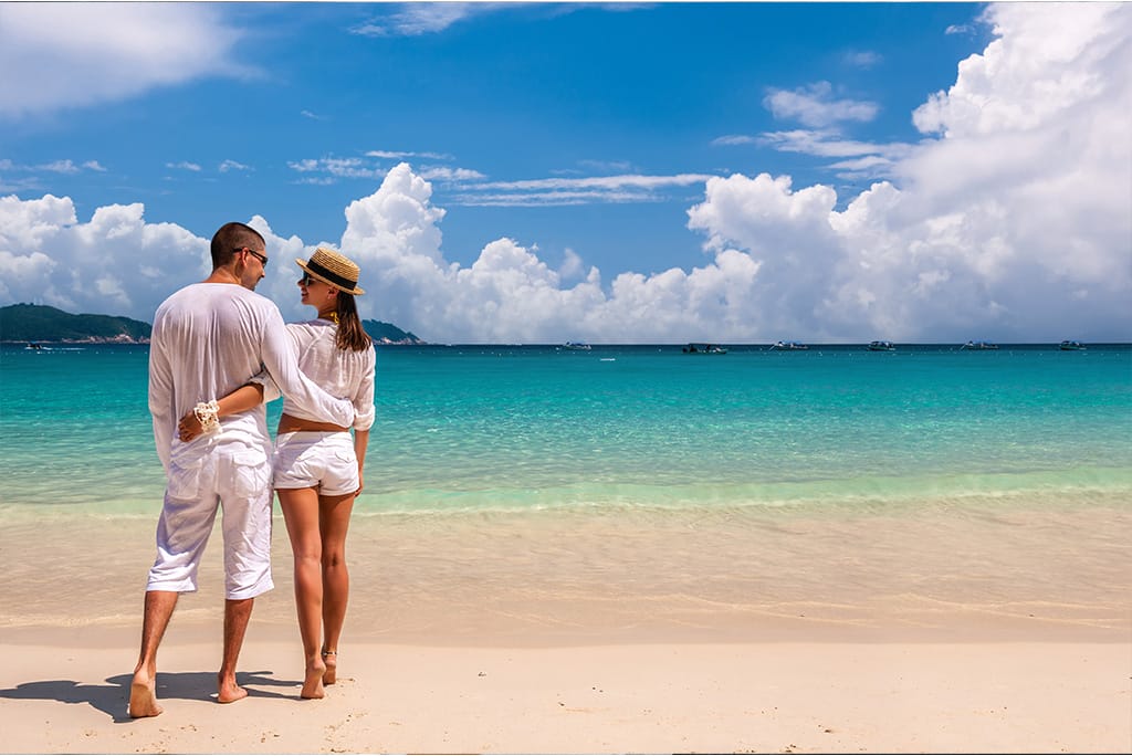 Couple in white at the beach