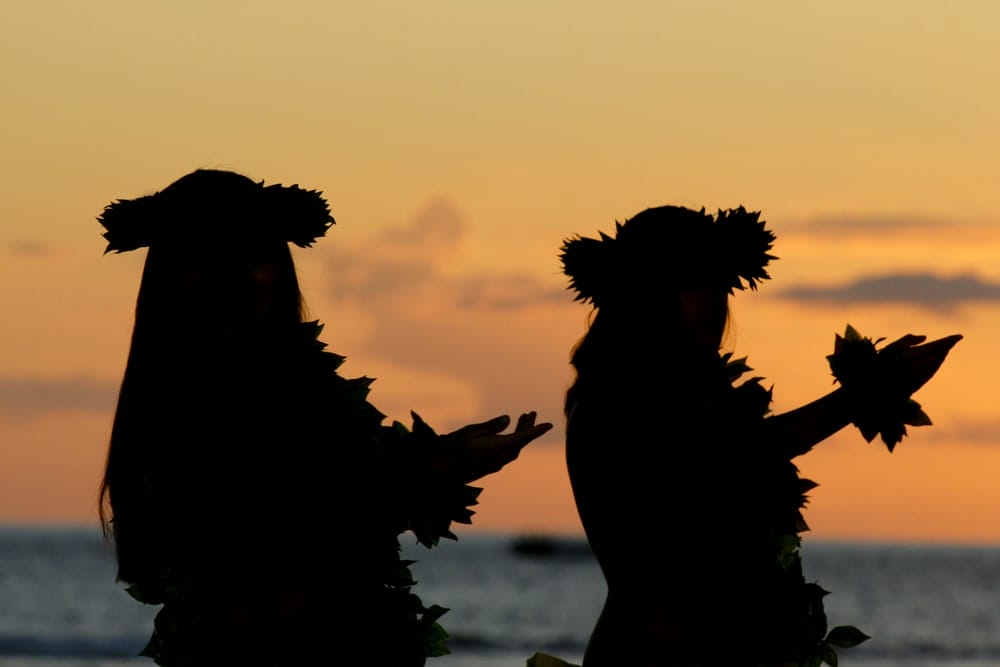 Hula dancers silhouetted at sunset on a Maui timeshare vacation