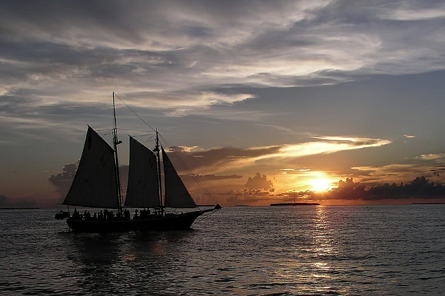 Sailboat at sunset off Key West, one of four warm getaways for winter