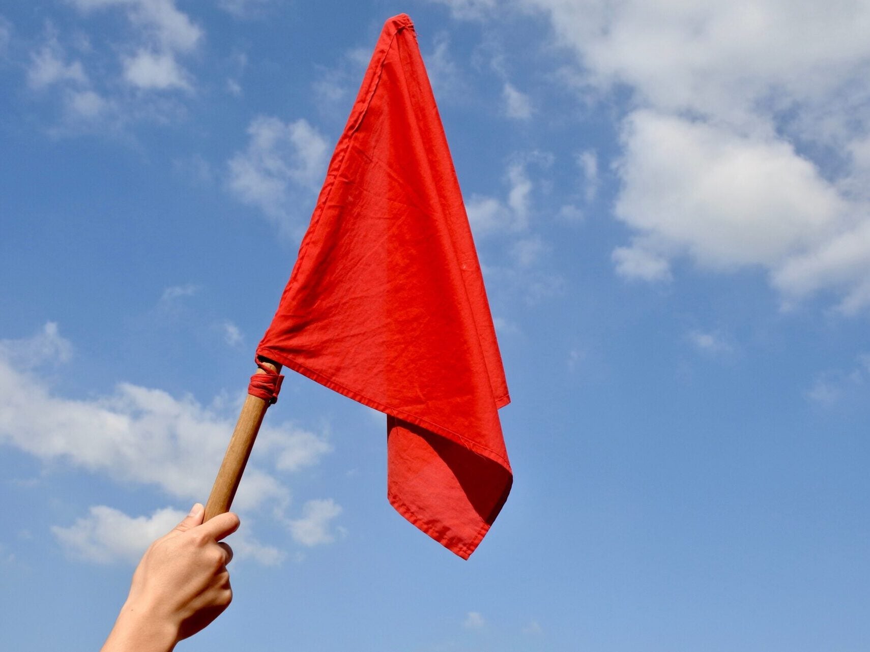Person Waving Red Flag